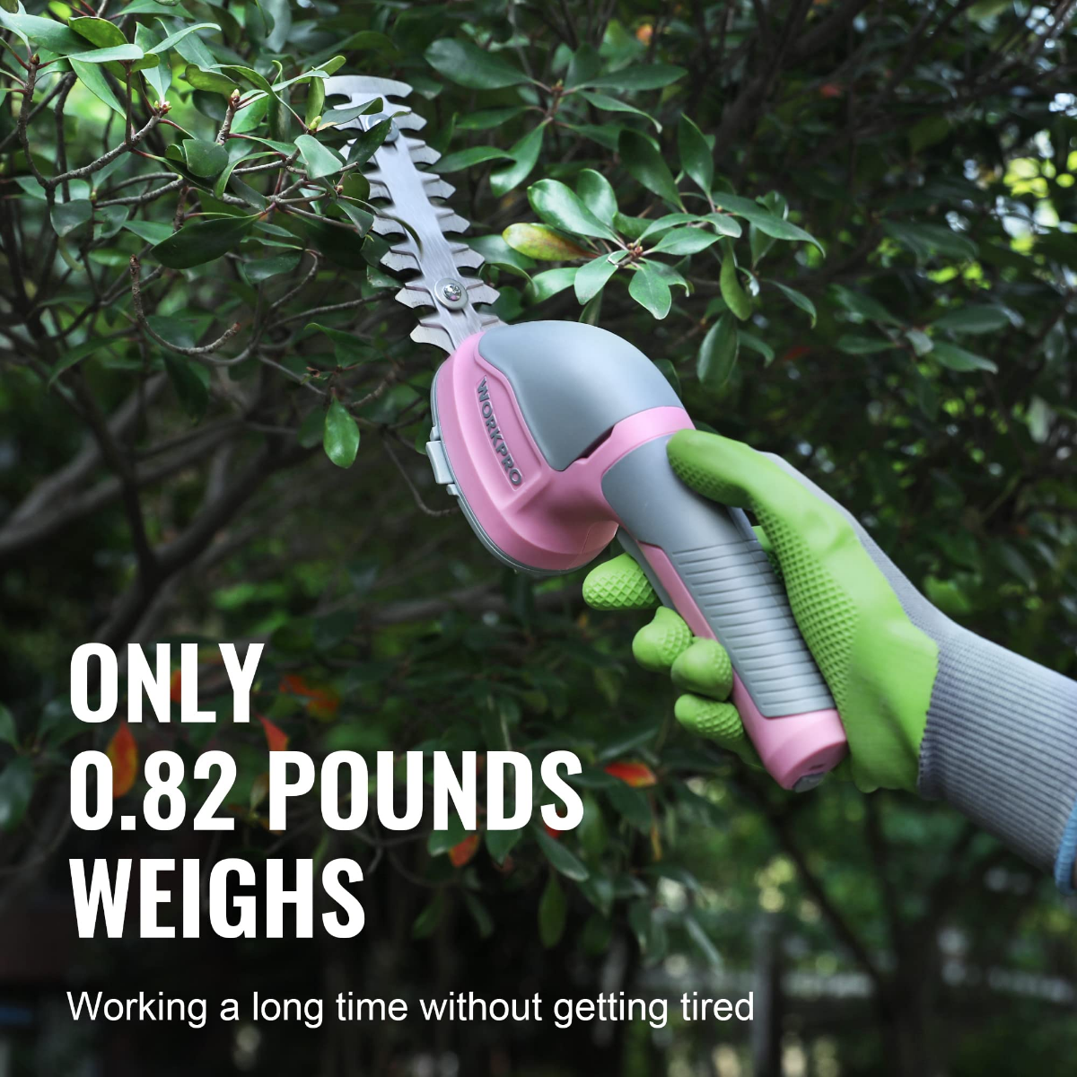 Cordless 2-in-1 shrub and grass trimmer in hand, pink-and-green grip