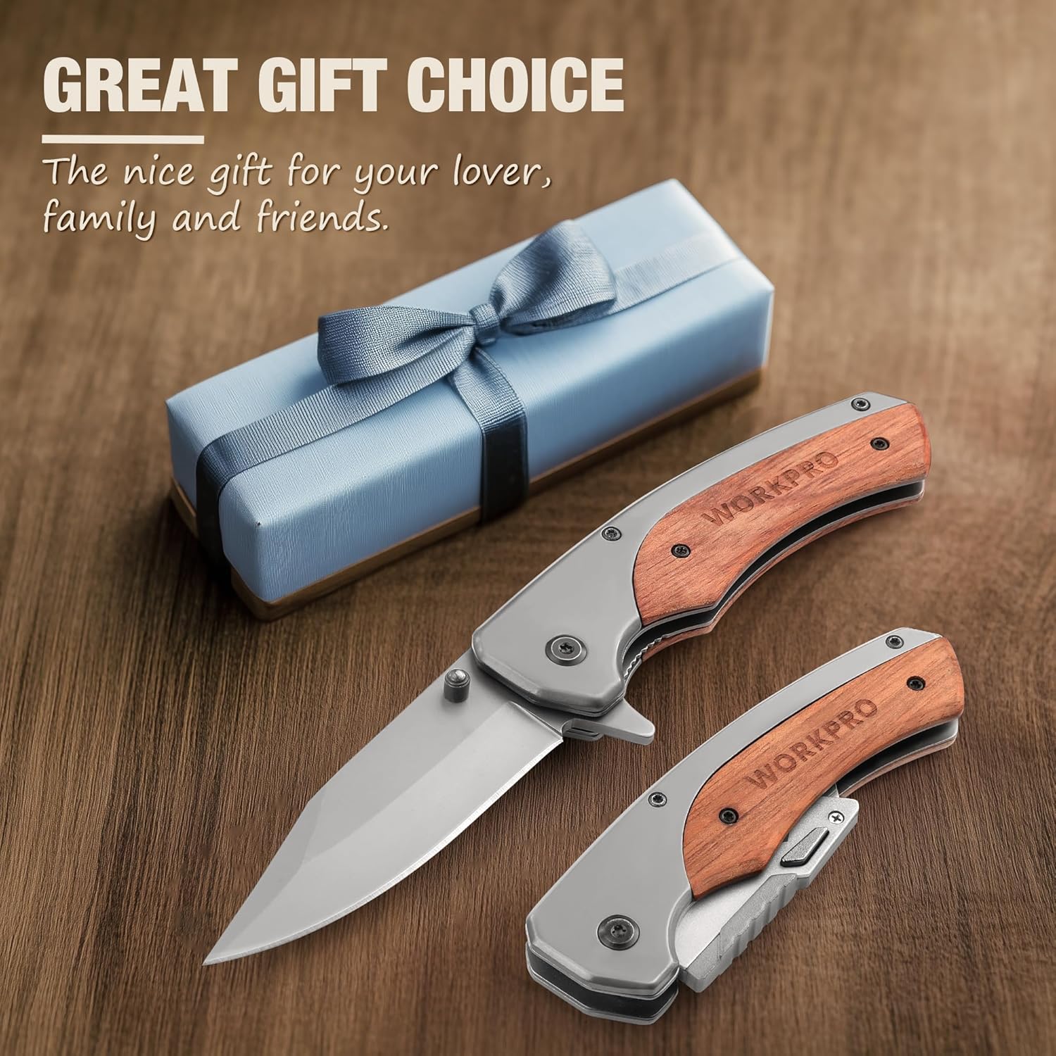Folding pocket knife set with rosewood handles beside a wrapped gift box
