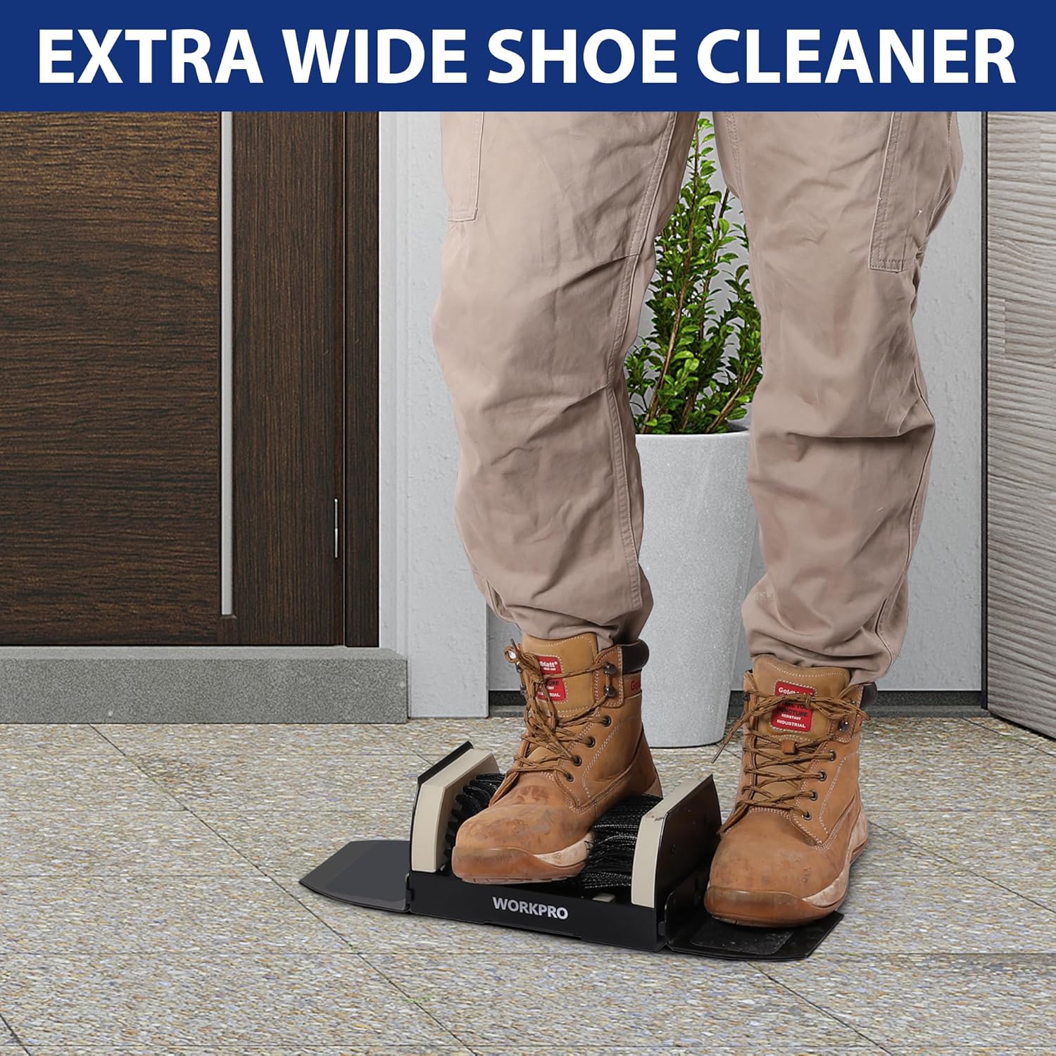 Extra wide shoe cleaner boot scrubber brush with black bristles beside tan boots