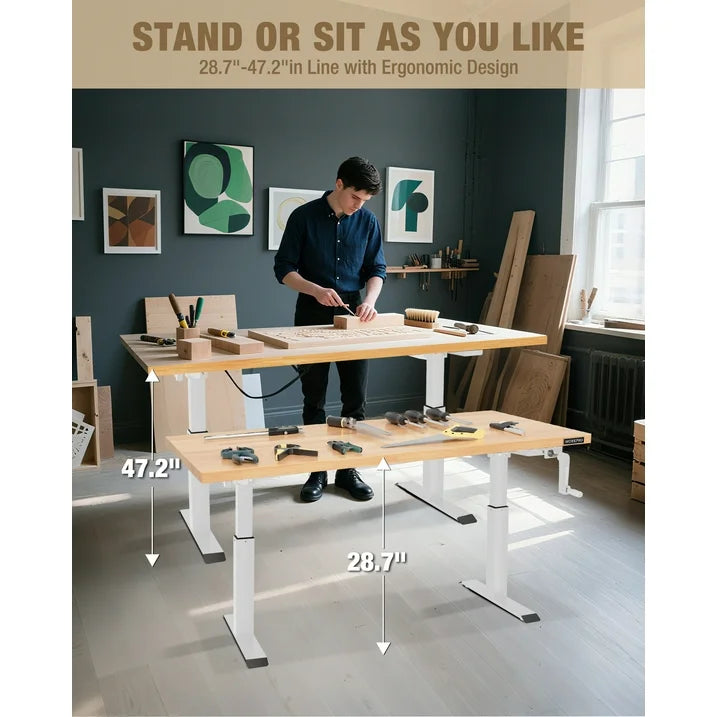 Adjustable height workbench with light wood tabletop and white legs in a workshop