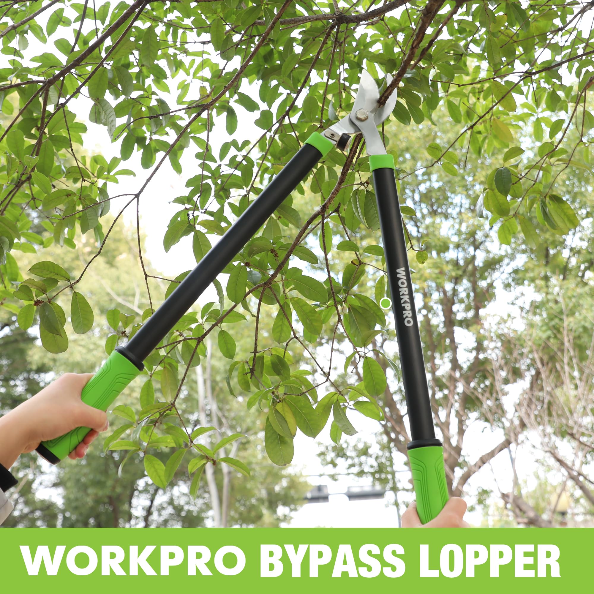WORKPRO bypass lopper held on leafy branches with green grips and black handles