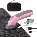 Pink and gray cordless electric scissors with storage case on dark textured fabric