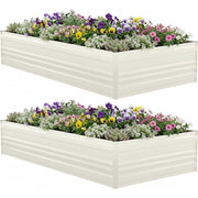 Two-tier view of a white raised garden bed filled with mixed flowers