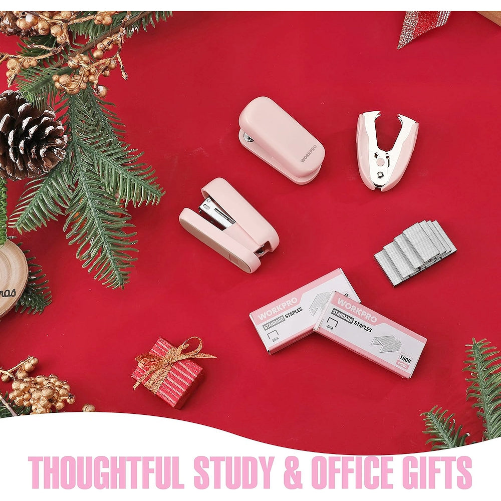 Pink mini staplers and staple remover on red holiday desk