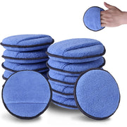 Stack of round blue microfiber applicator pads with black trim