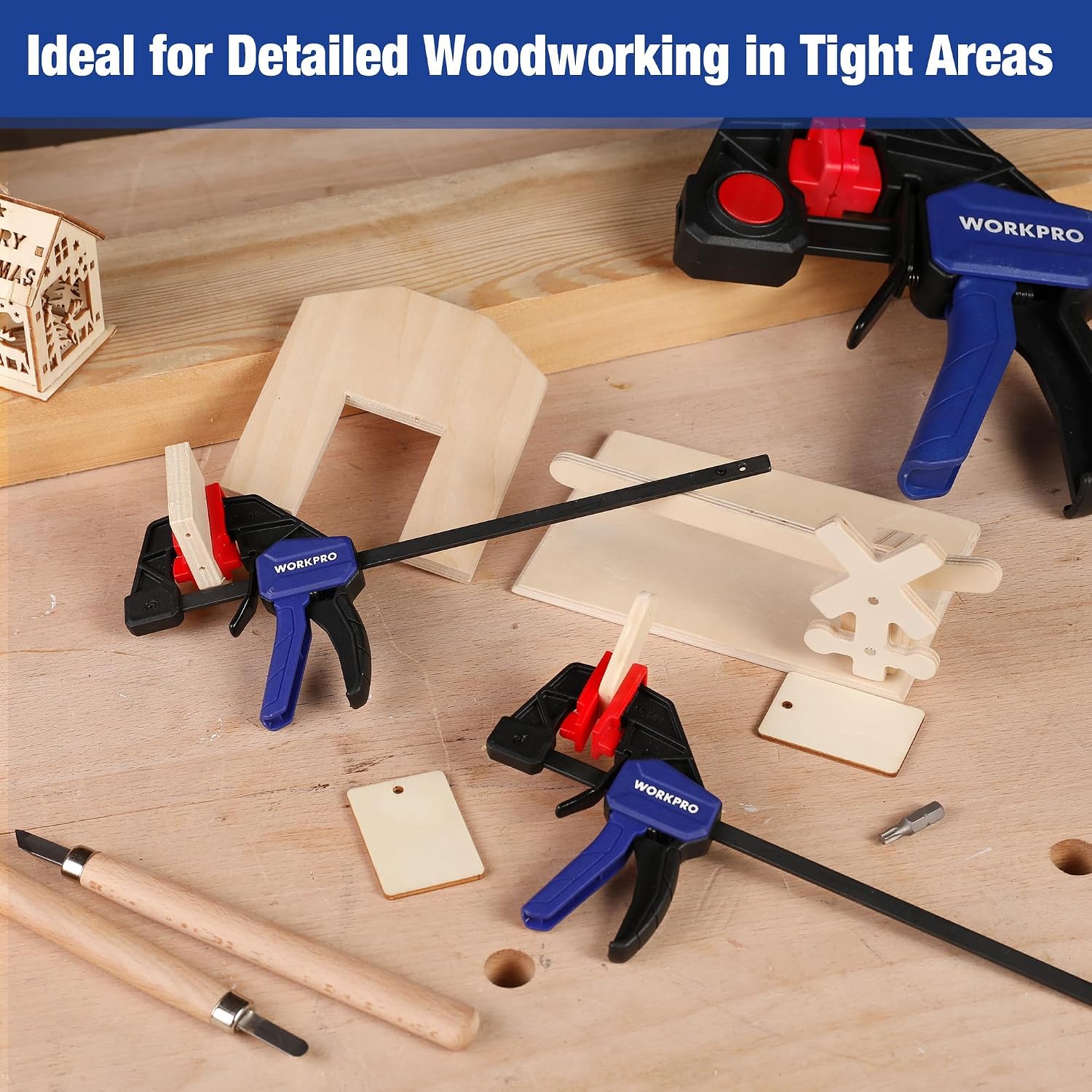 WORKPRO mini bar clamps on a woodworking bench, blue handles with red jaw pads