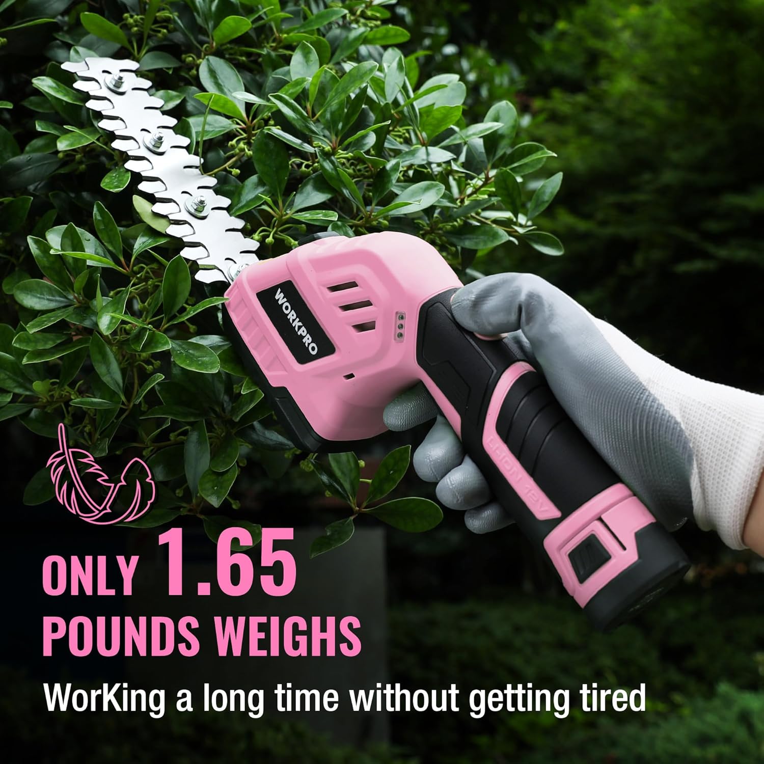 Pink cordless shrub trimmer in gloved hand with long comb blade