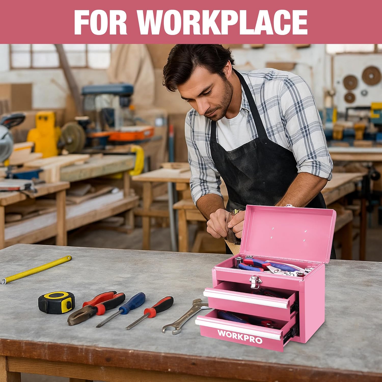 Pink portable mini tool chest on workbench with open drawers and tools inside