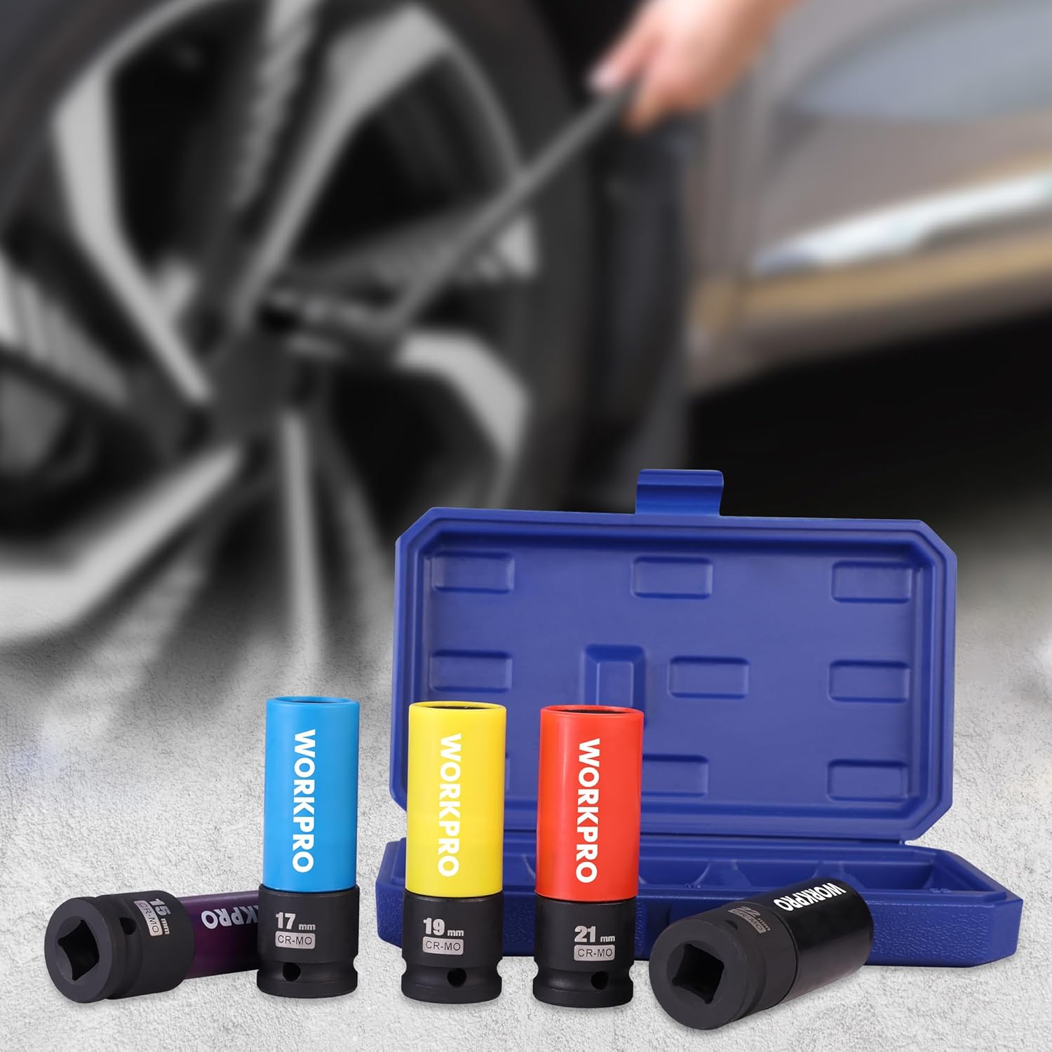 Five lug nut sockets with colored non-marring sleeves beside an open blue storage case