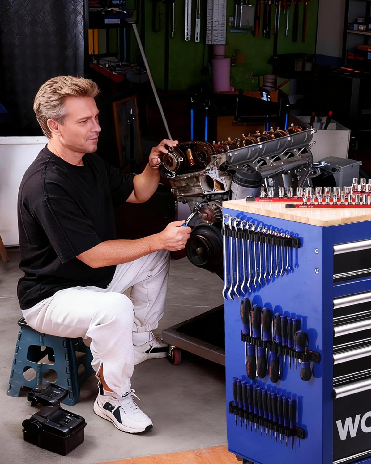Shop wall magnetic organizer rails with sockets and screwdrivers in multiple rows