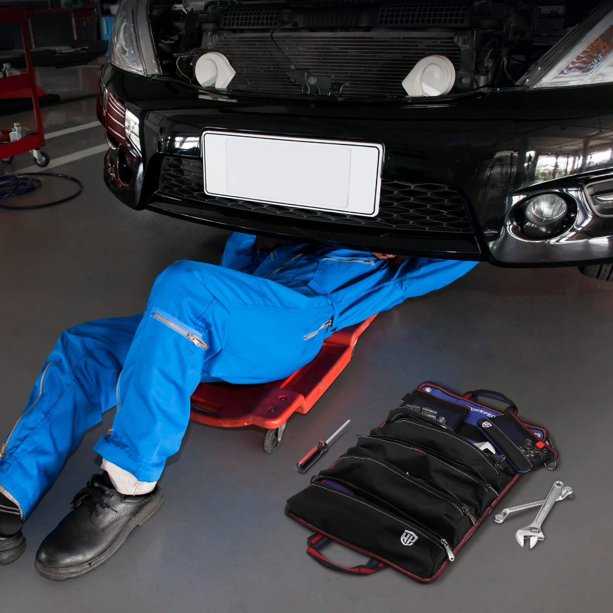 Black tool roll organizer with detachable pouches laid open, with wrenches beside it