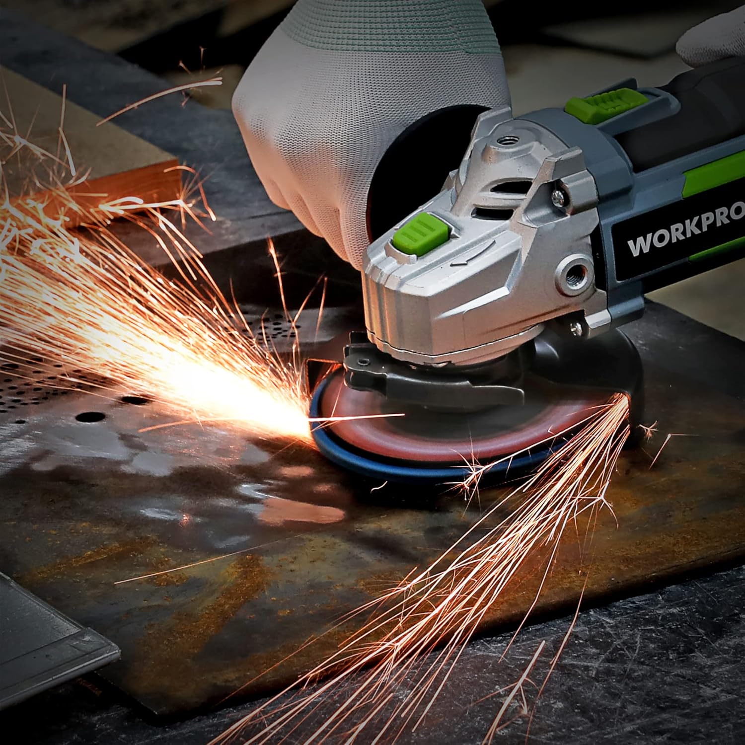 Flap sanding disc grinding metal with orange sparks from an angle grinder