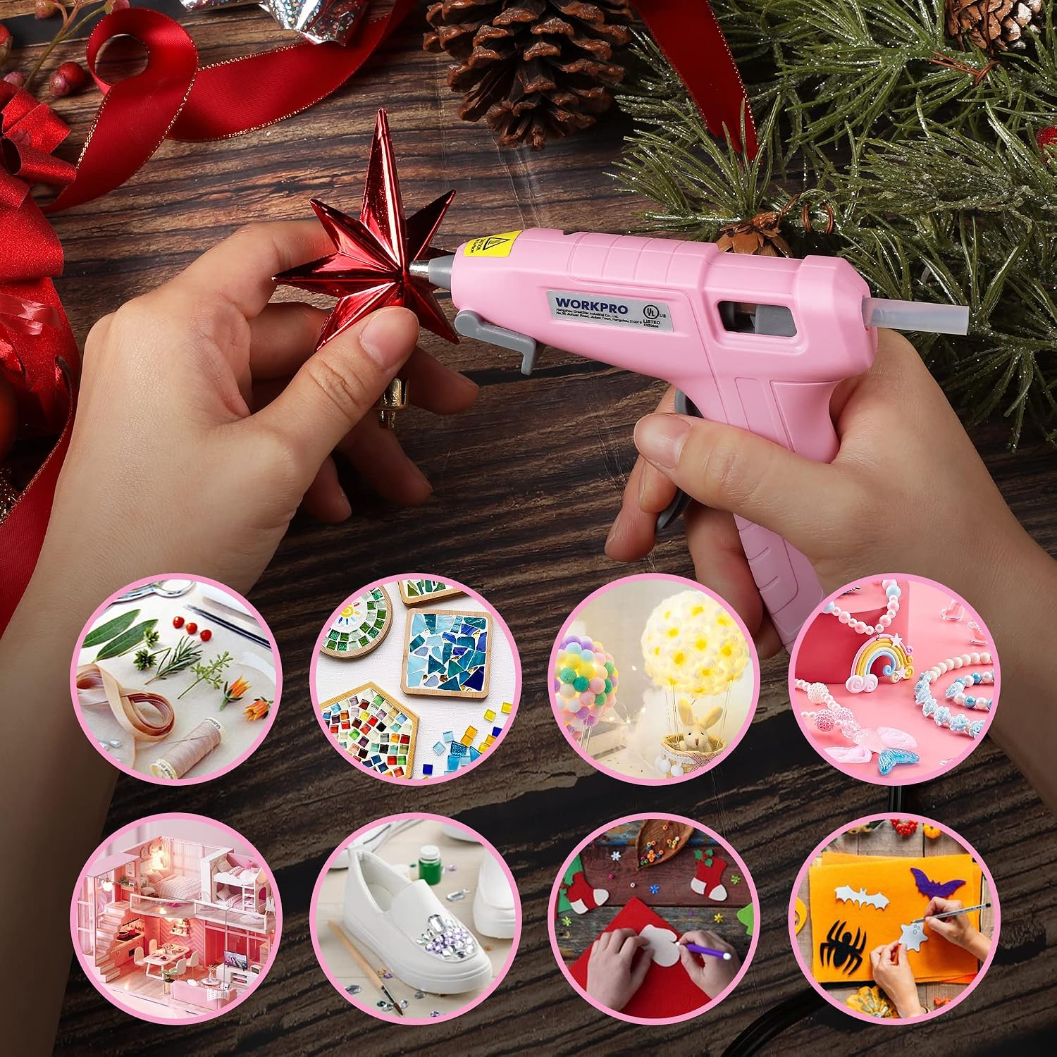 Pink mini hot glue gun applying glue to craft ribbon and ornaments on wood