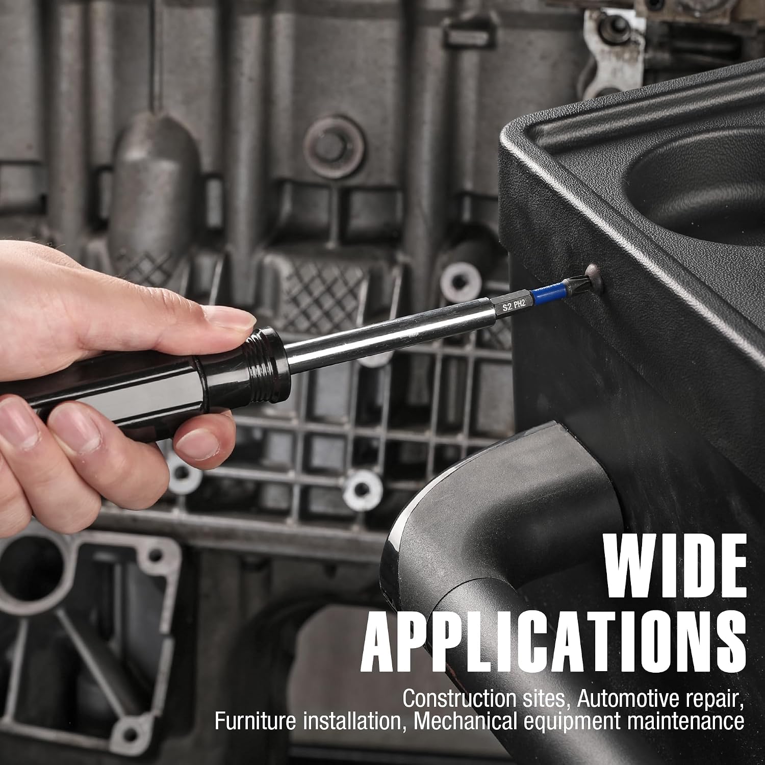 Hand using a PH2 impact bit with 1/4 in hex shank on metal equipment