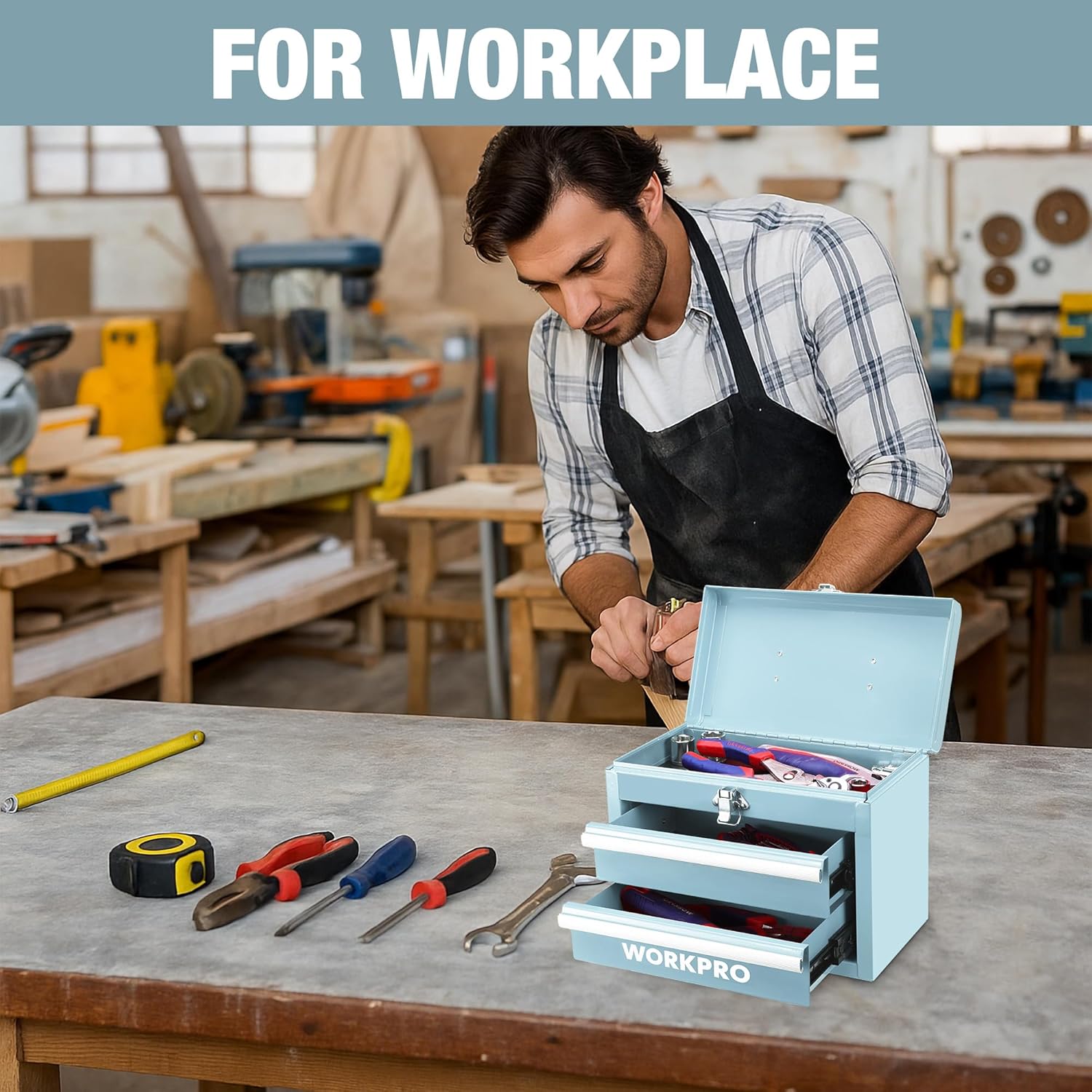 Light blue mini tool box open on a workbench with two drawers and visible tools.