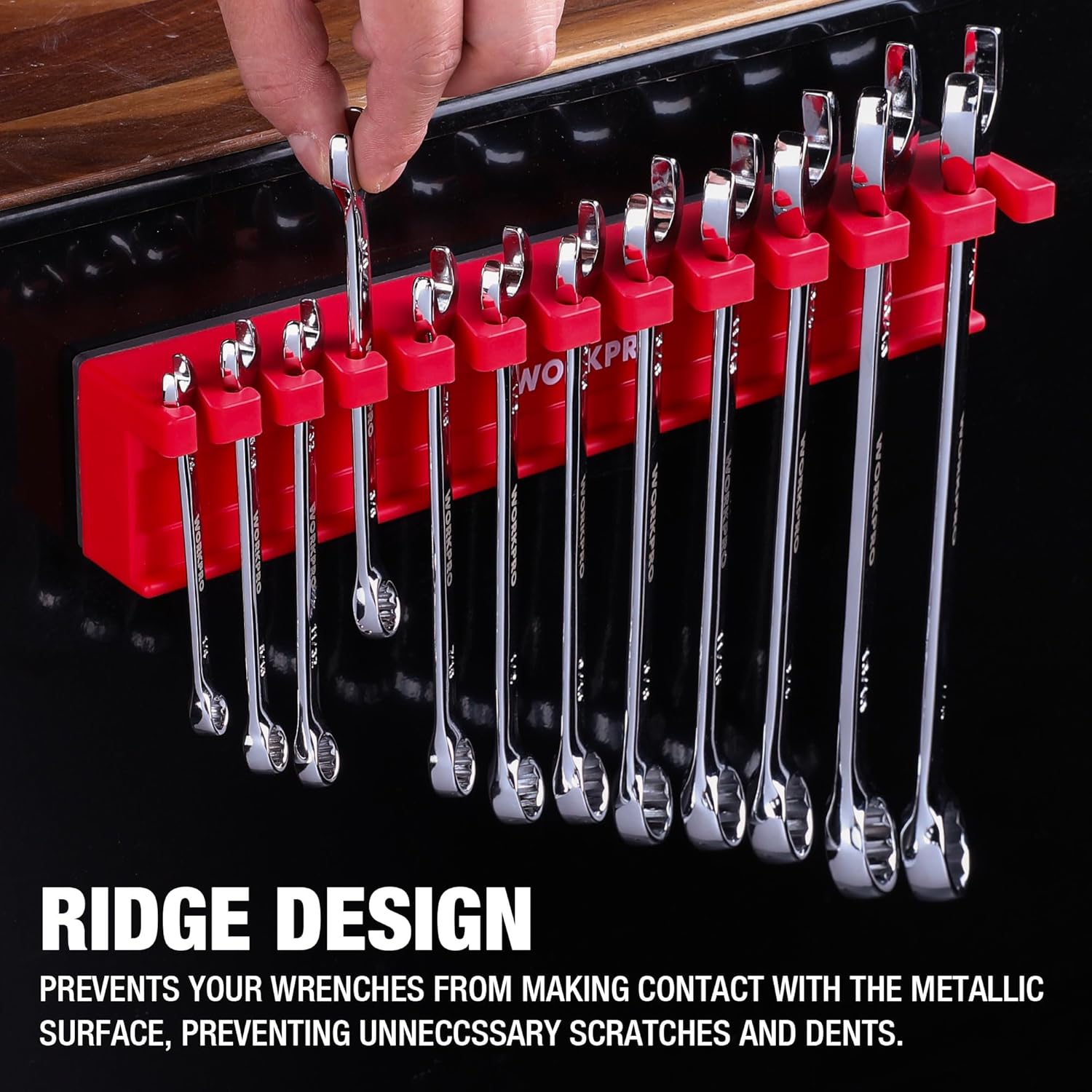 Magnetic wrench organizer with red slots and chrome wrenches mounted on a black panel