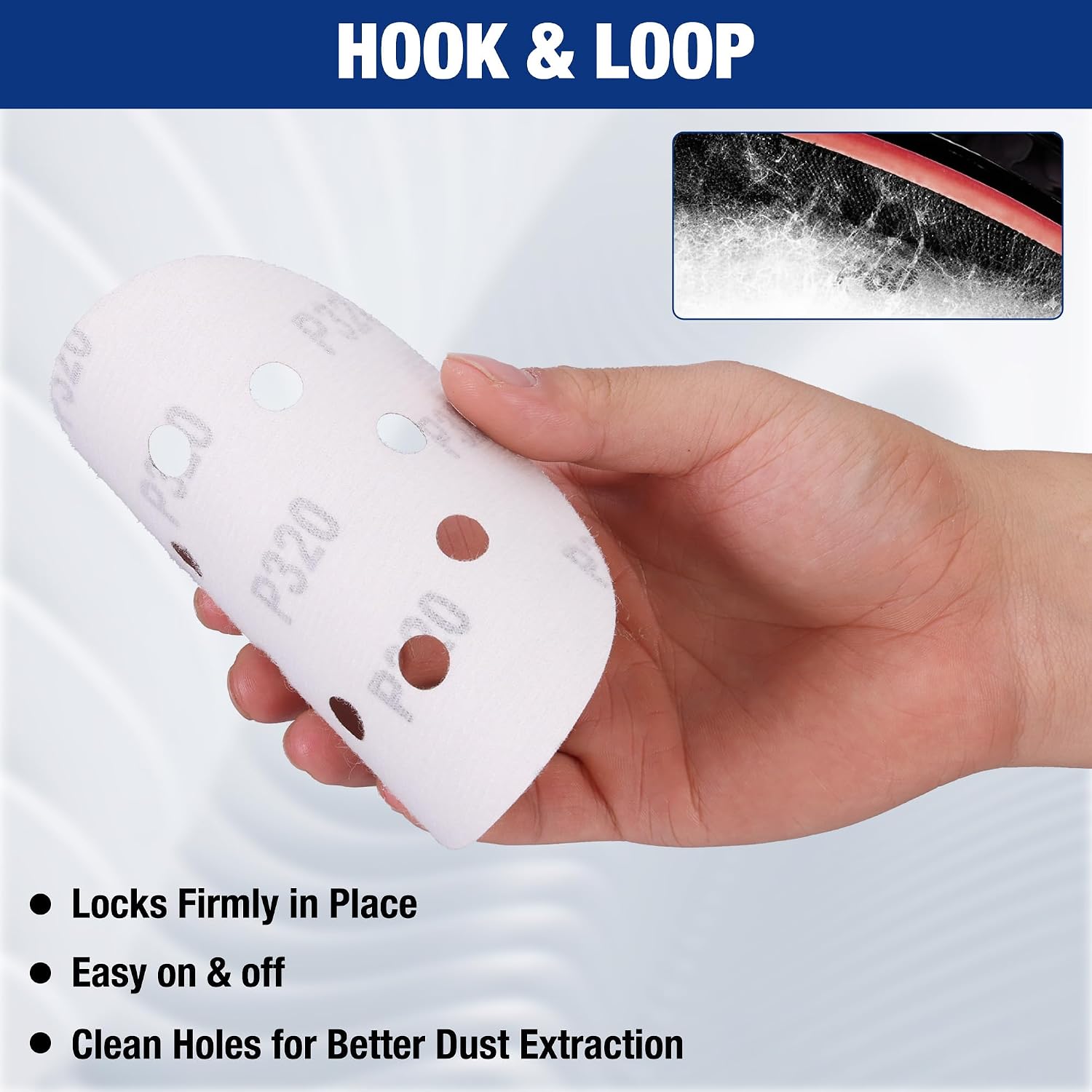White hook-and-loop sanding disc with 8 holes, held in hand for quick attachment
