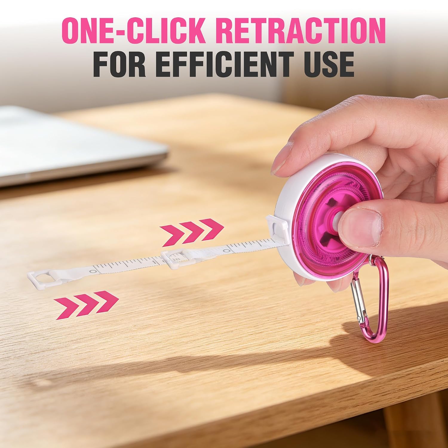 Pink retractable tape measure pulled out and clicking back for retraction