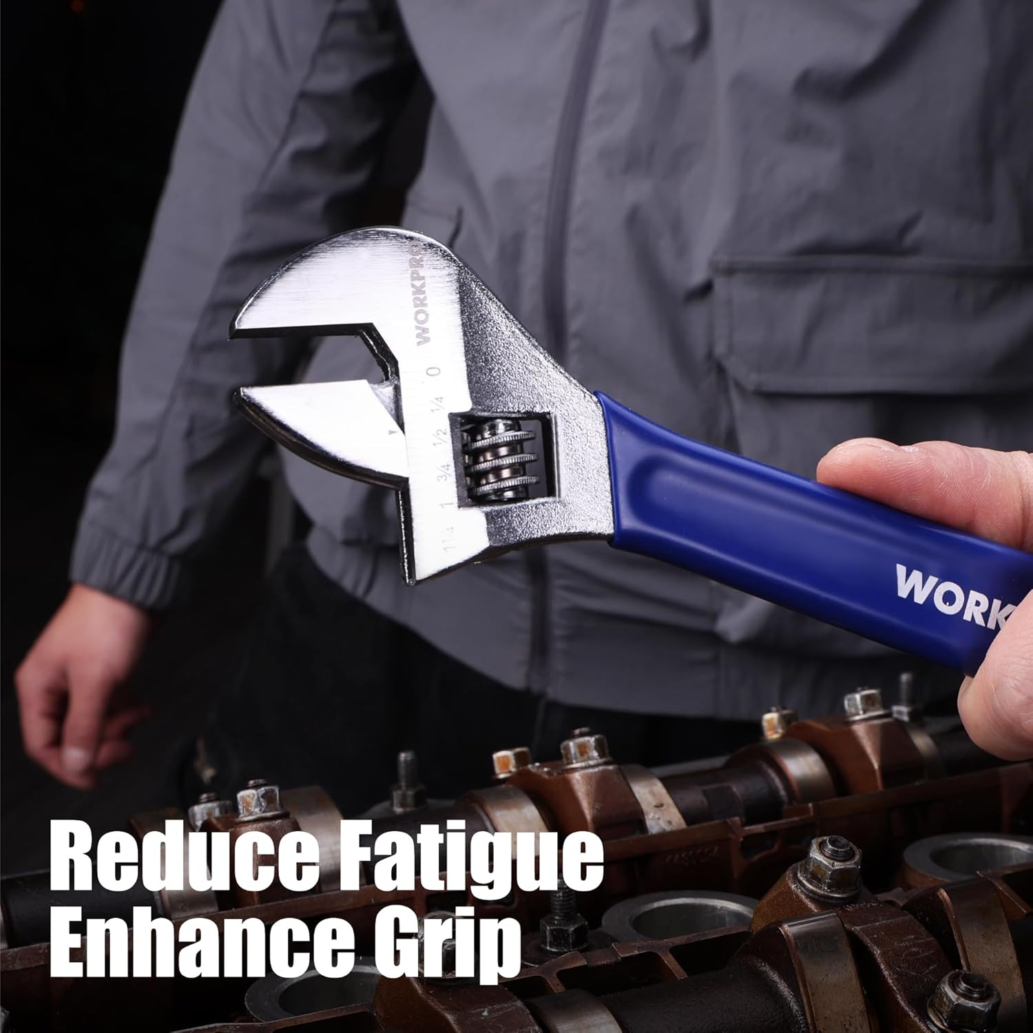 Adjustable wrench held by hand: chrome head with blue ergonomic rubber grip.