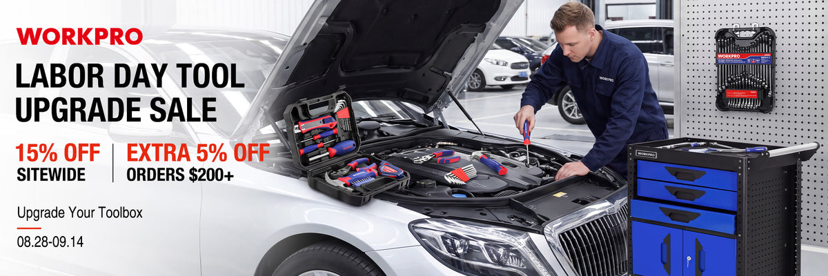 Mechanic working in an open car hood with a tool kit, showing innovation and quality in a workshop setting