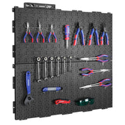Black metal pegboard wall panel with assorted tool hooks and pliers