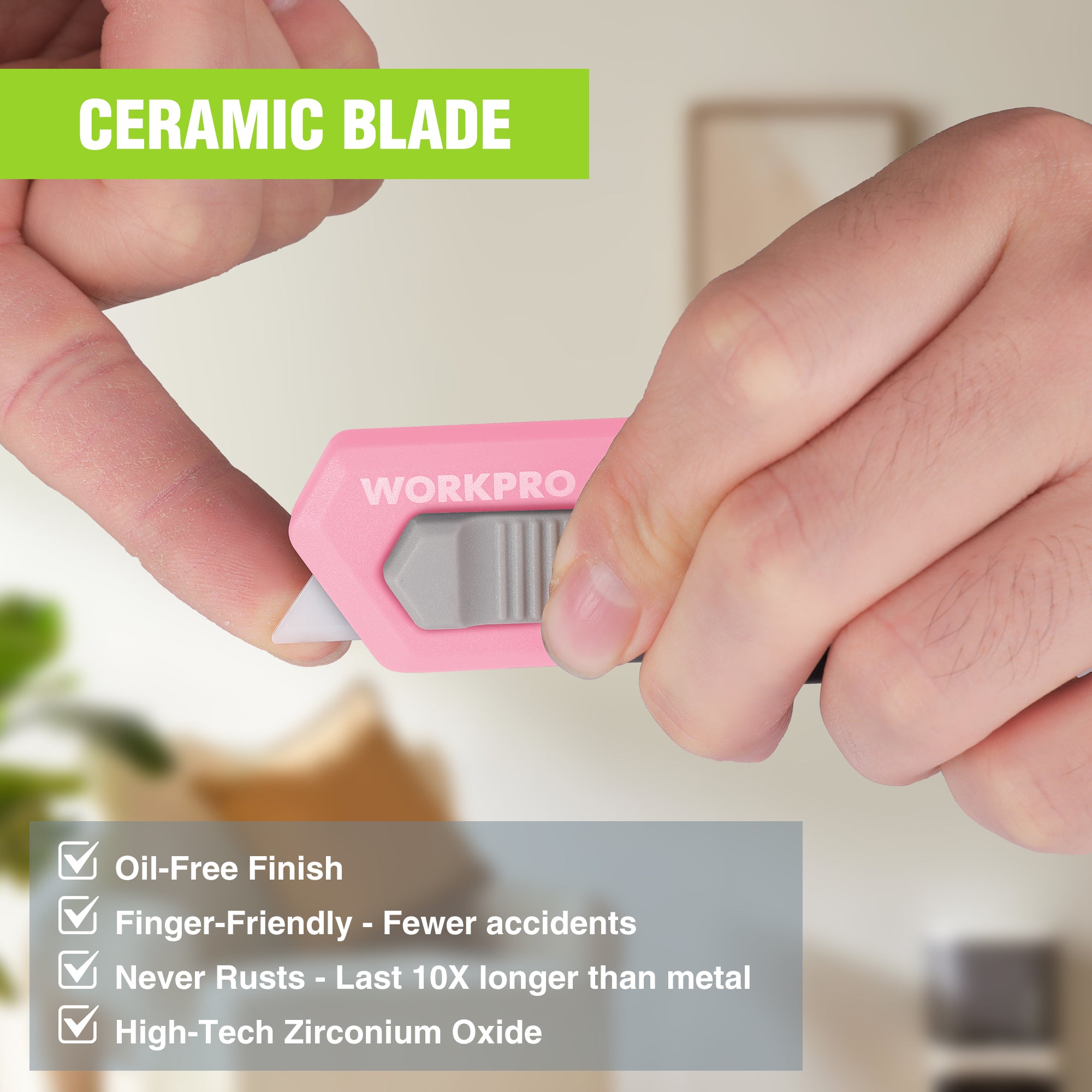 Pink ceramic blade safety box cutter cartridge, close-up of blade window