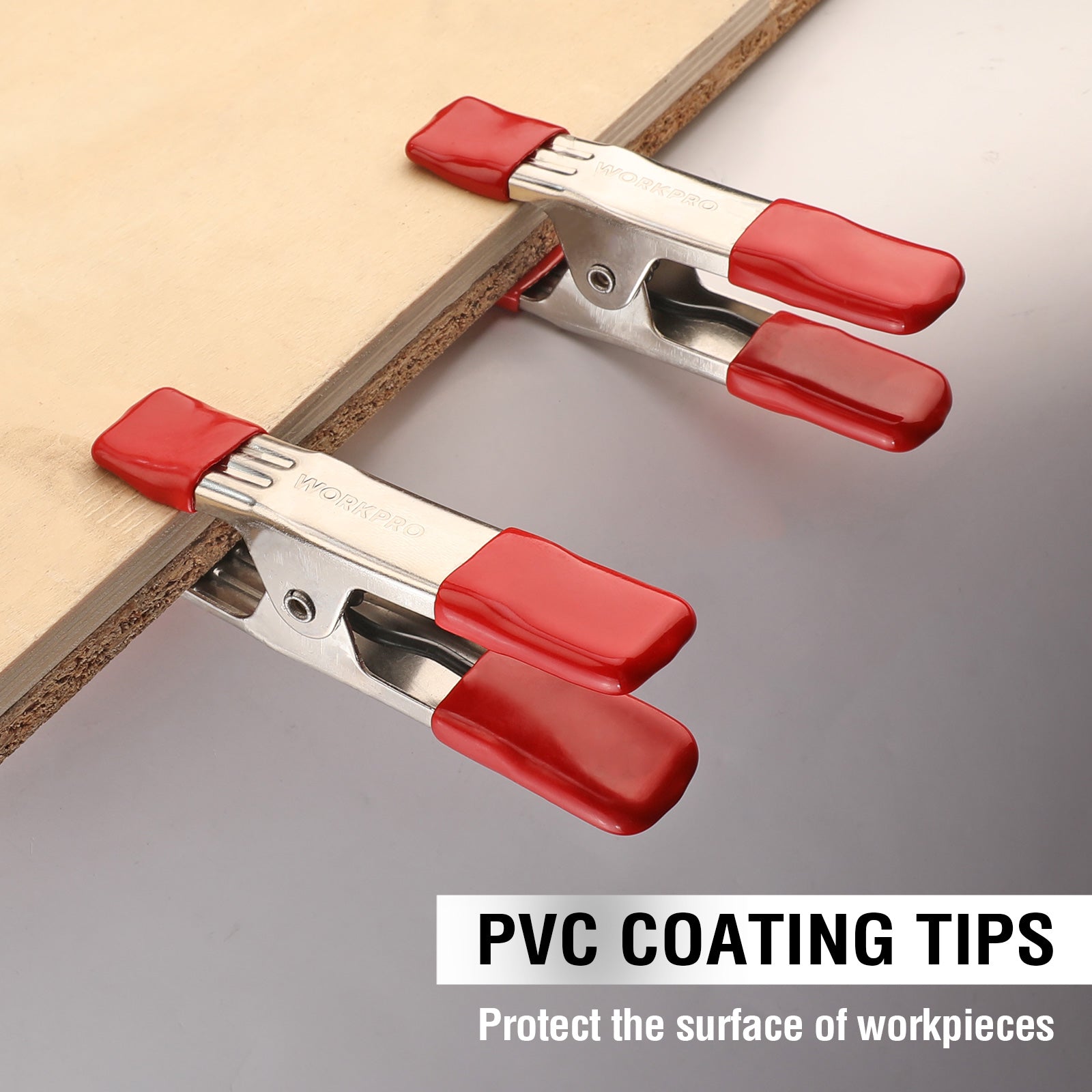 Red PVC-coated tip spring clamps holding wood board edge