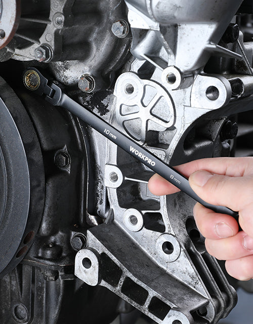 Hand using a WORKPRO 10mm wrench on an engine bracket, showing innovation and quality in secure work