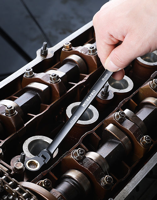 Hand using a 10mm wrench on a metal tool kit with innovation and quality components inside