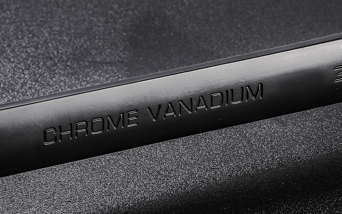 Chrome handle with CHROME VANADIUM lettering on a textured dark surface, showing innovation and quality