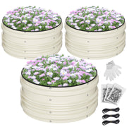 Three white raised garden beds filled with pink and purple flowers and daisies