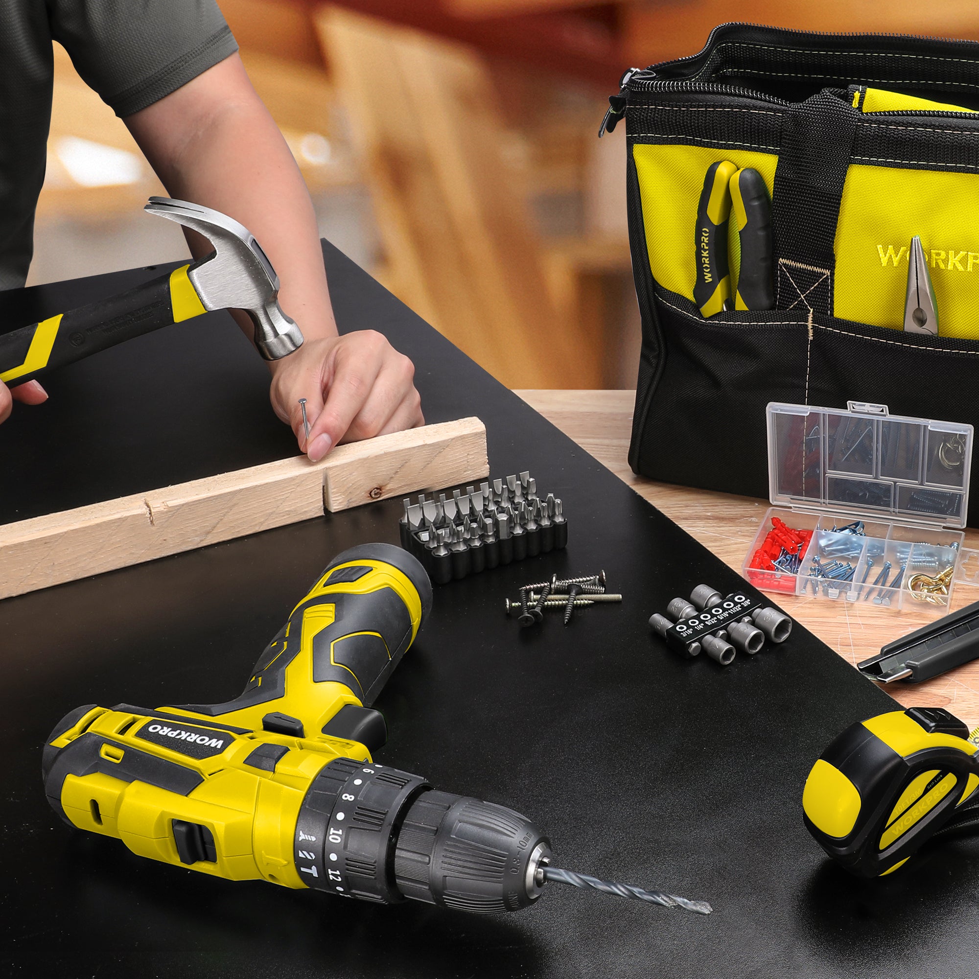 Cordless drill/driver holding a drill bit with screwdriving bits and fasteners
