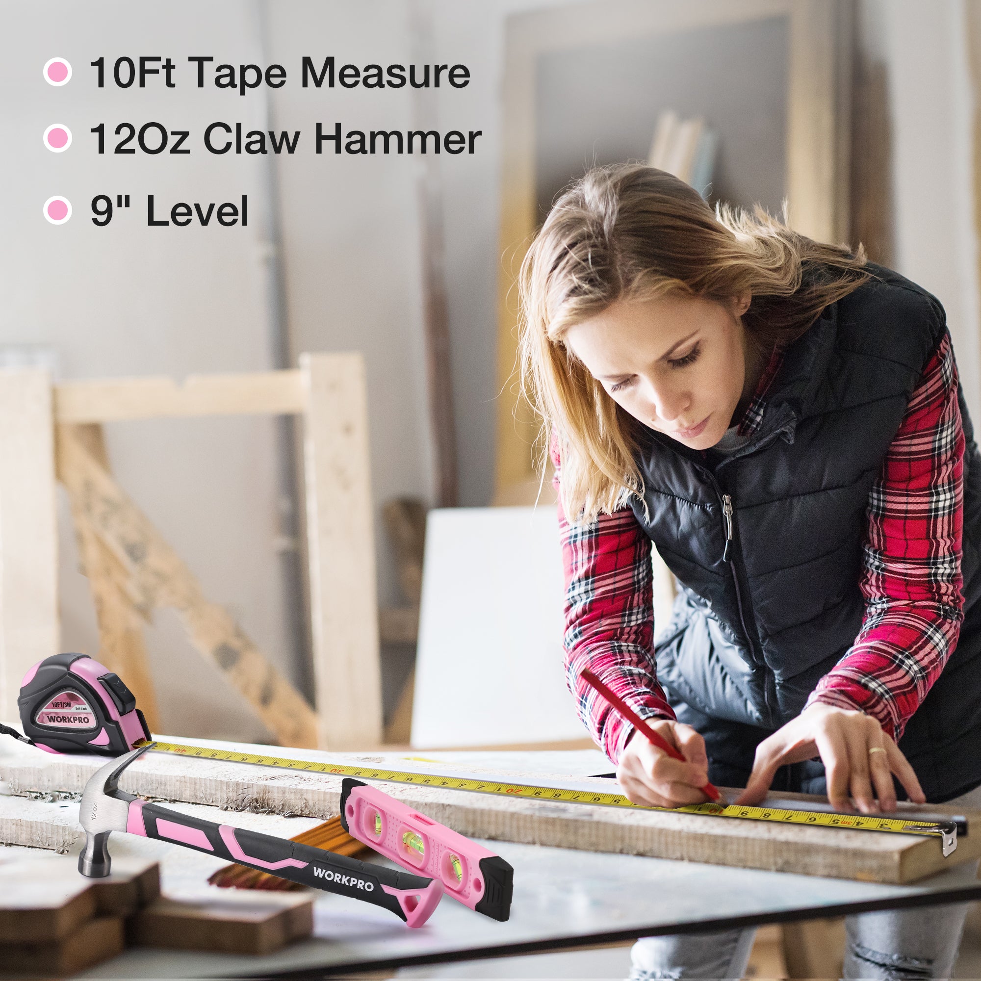 Pink tape measure and level on a workbench with home DIY tool kit tools in use.