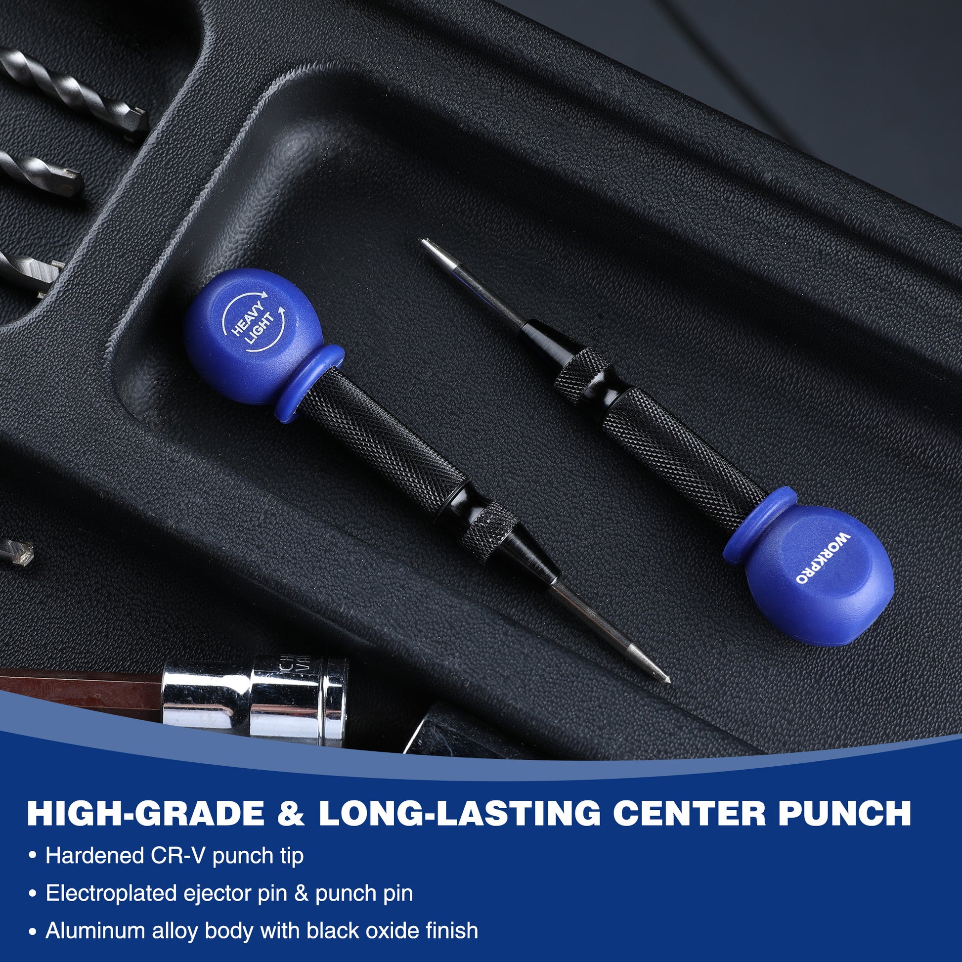Blue-handled center punch with black knurled grip and metal tip in a storage tray