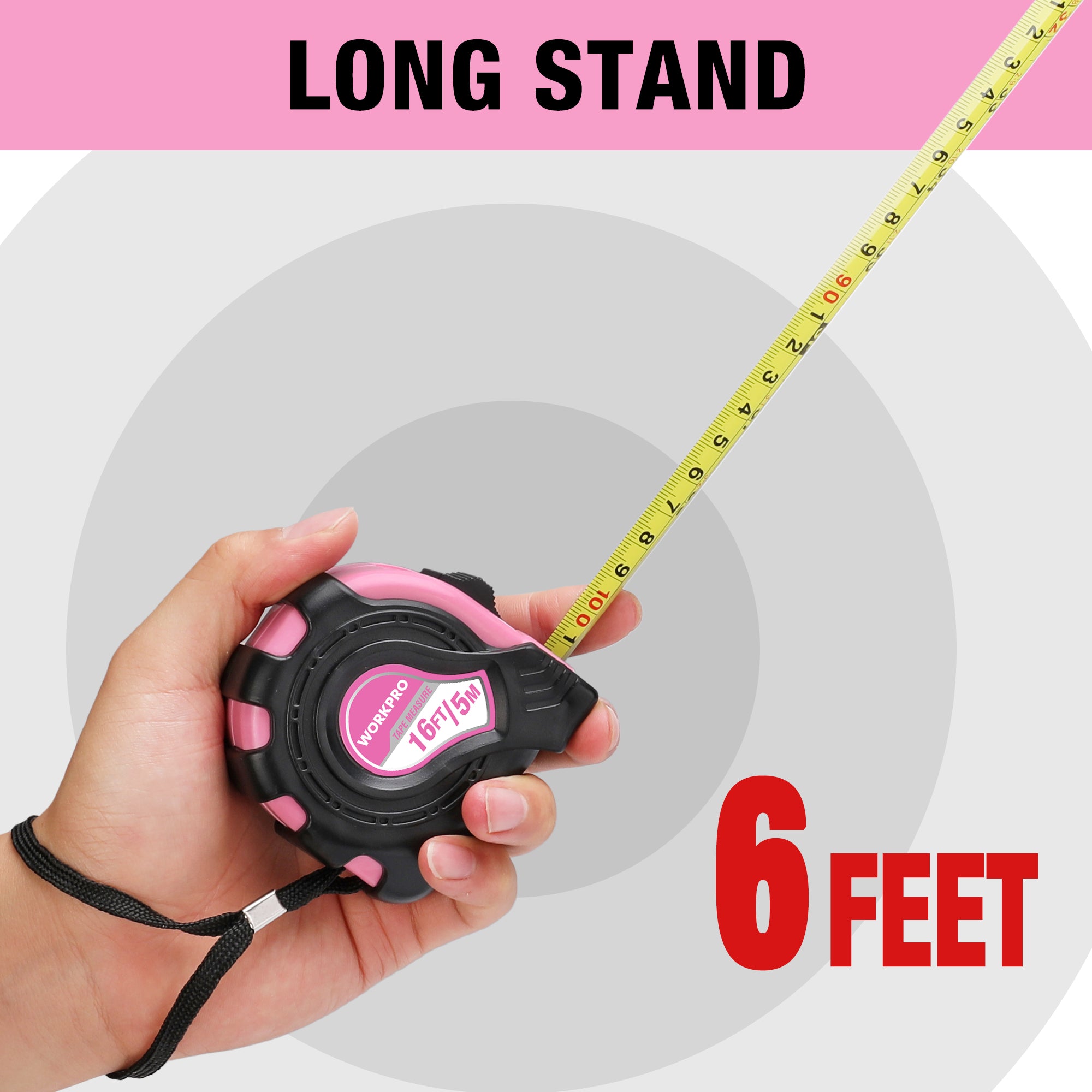 Pink tape measure with black case held in hand, long yellow tape extended