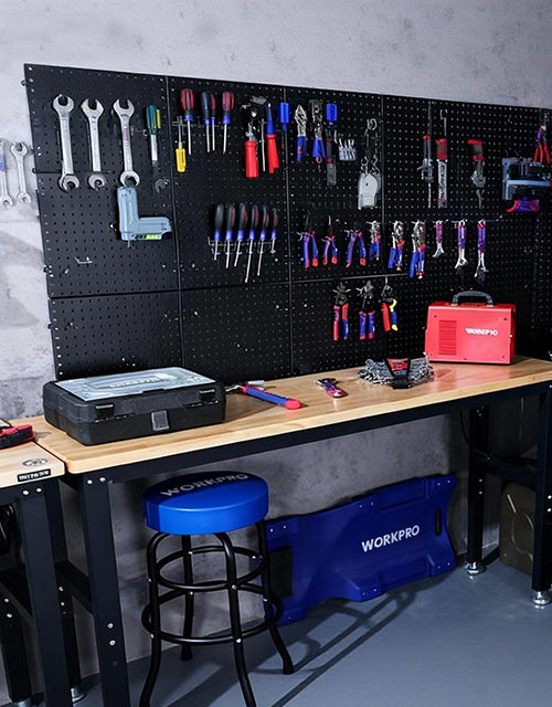 Tool workbench with pegboard holding wrenches and pliers, innovation and quality in organized storage