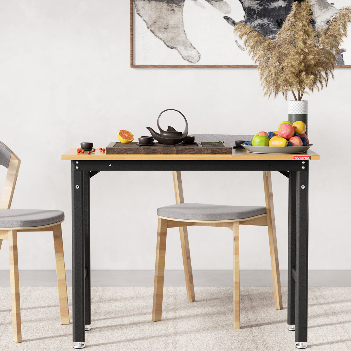 Workbench with light wood top and black frame supported by adjustable feet