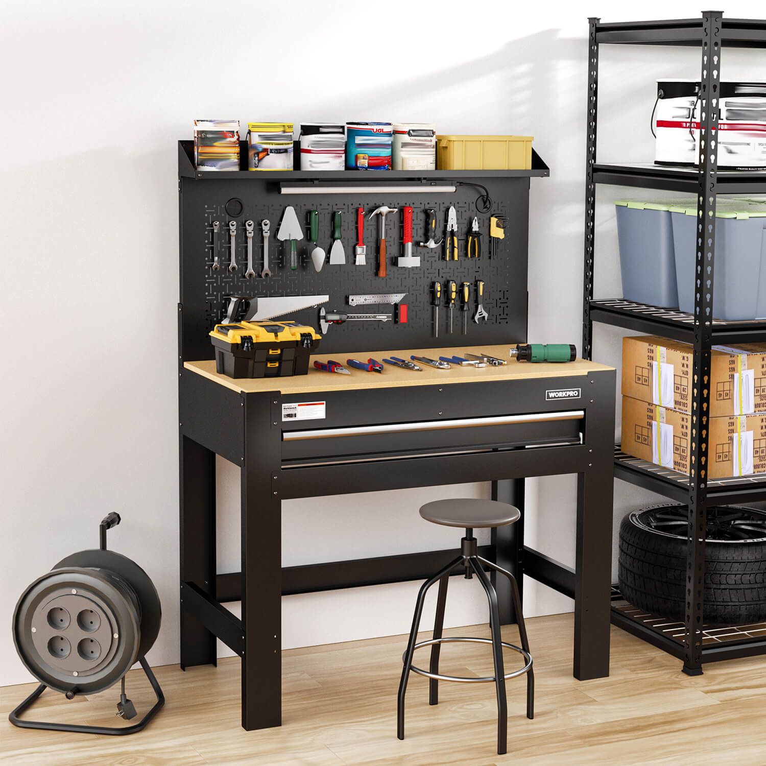 Black workbench with pegboard toolboard, pull-out drawer, and open storage shelf