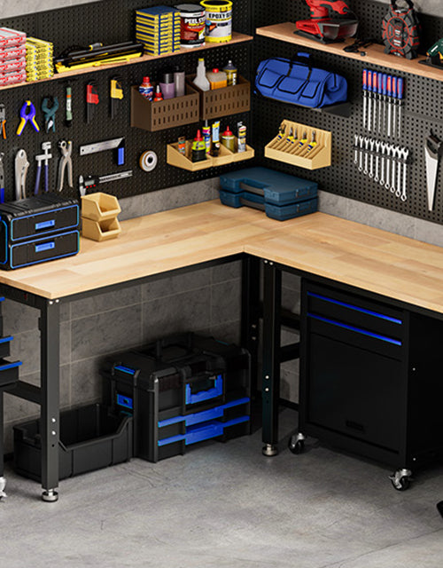 Workshop tool bench with drawers and shelves, innovation and quality tools arranged on pegboards