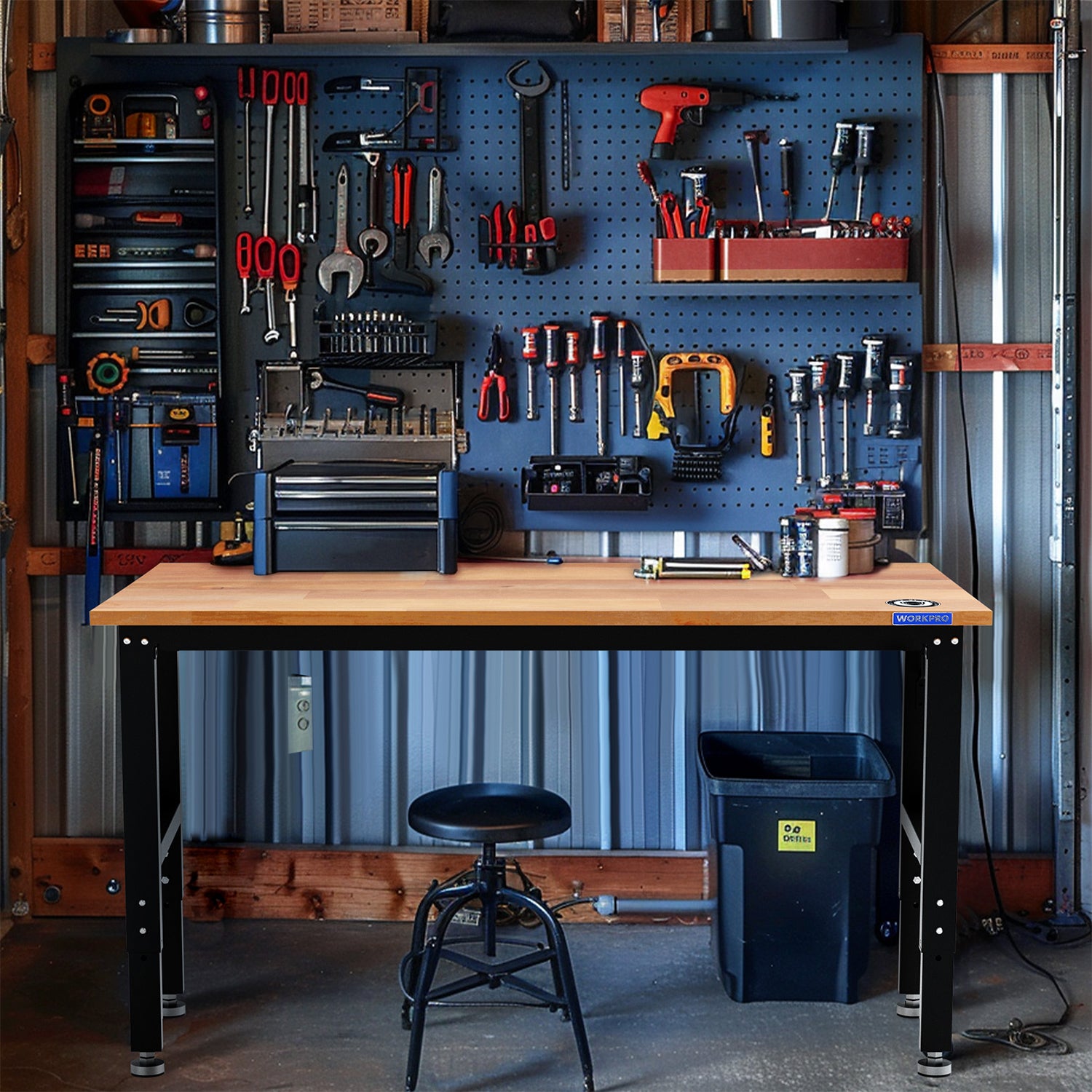 Hardwood adjustable workbench with black frame holding tools in a garage workshop