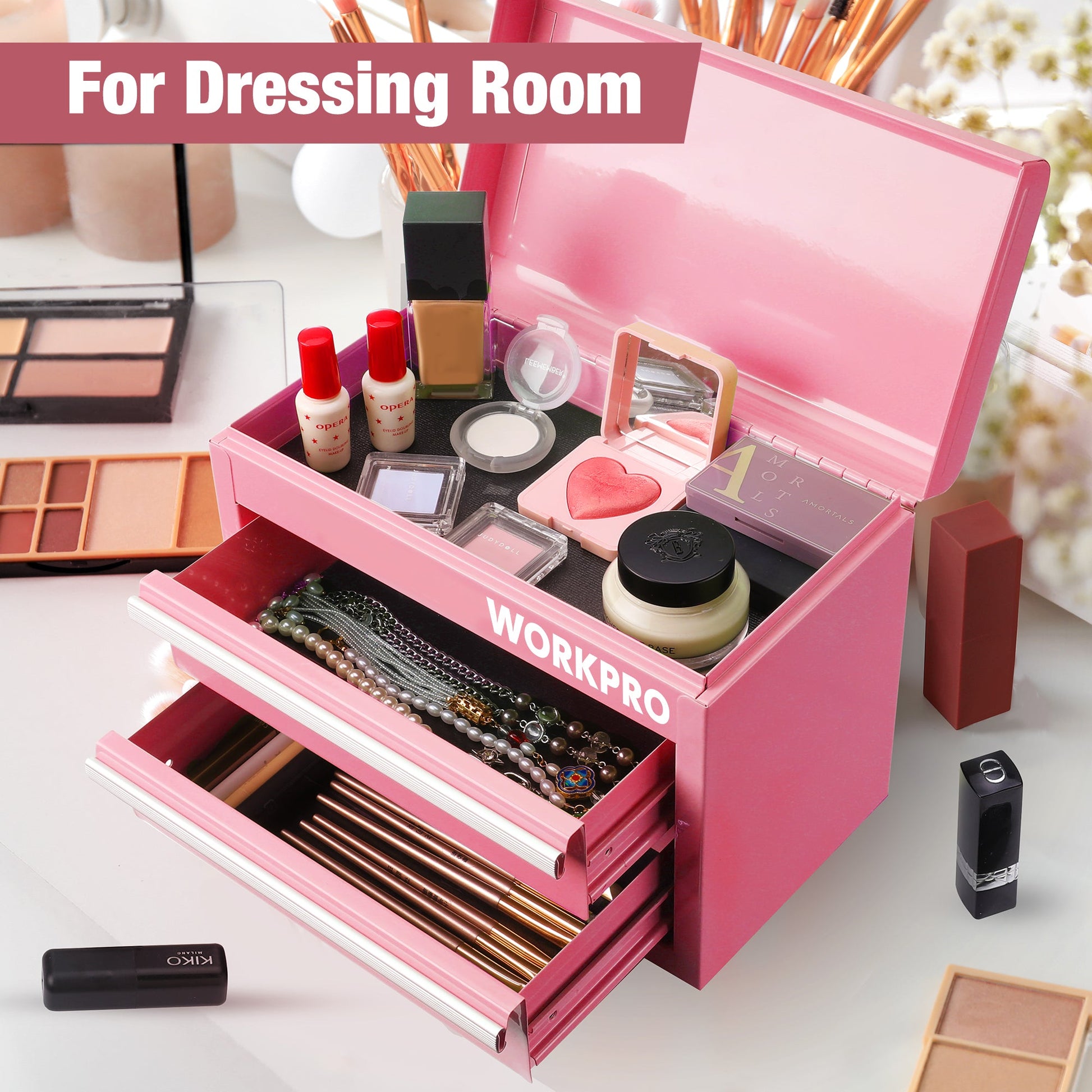 Pink mini tool box used for cosmetics, open top storage and two organizer drawers.