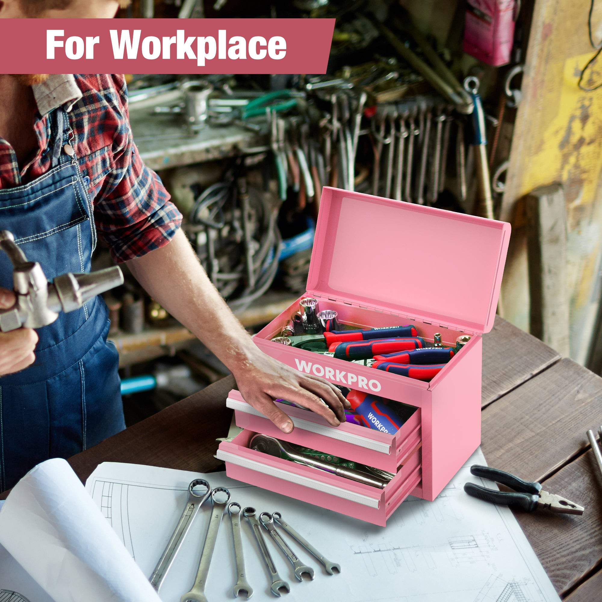 Pink mini metal toolbox open with two drawers and tools inside