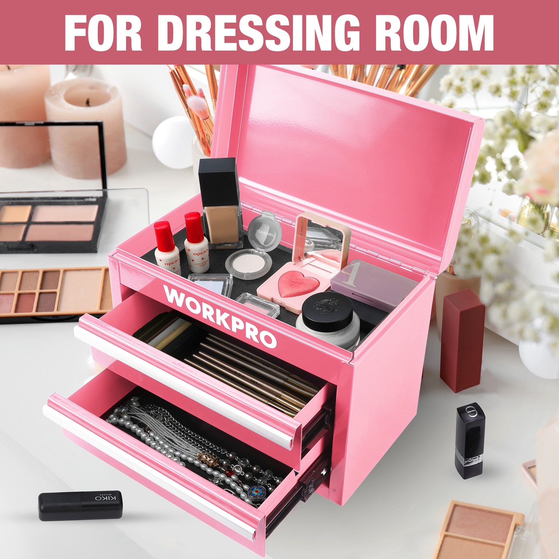 Pink mini metal tool box open for cosmetics, showing two drawers and top lid storage