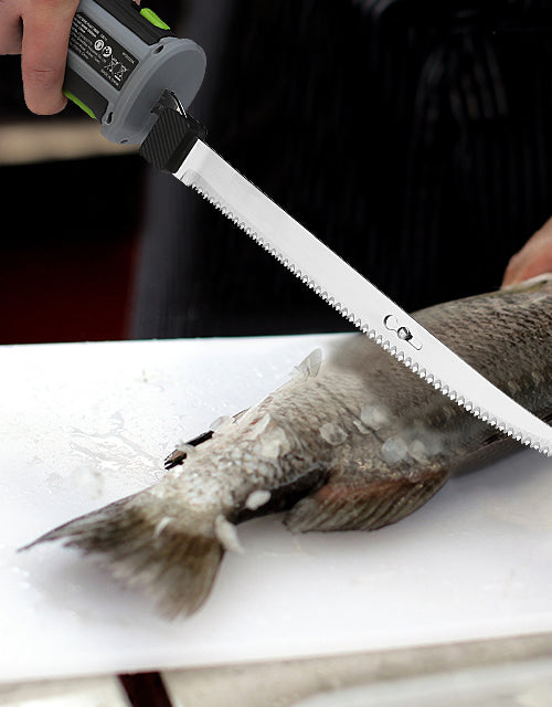 Handheld saw cutting a fish on a white cutting board, with innovation and quality visible in the tool