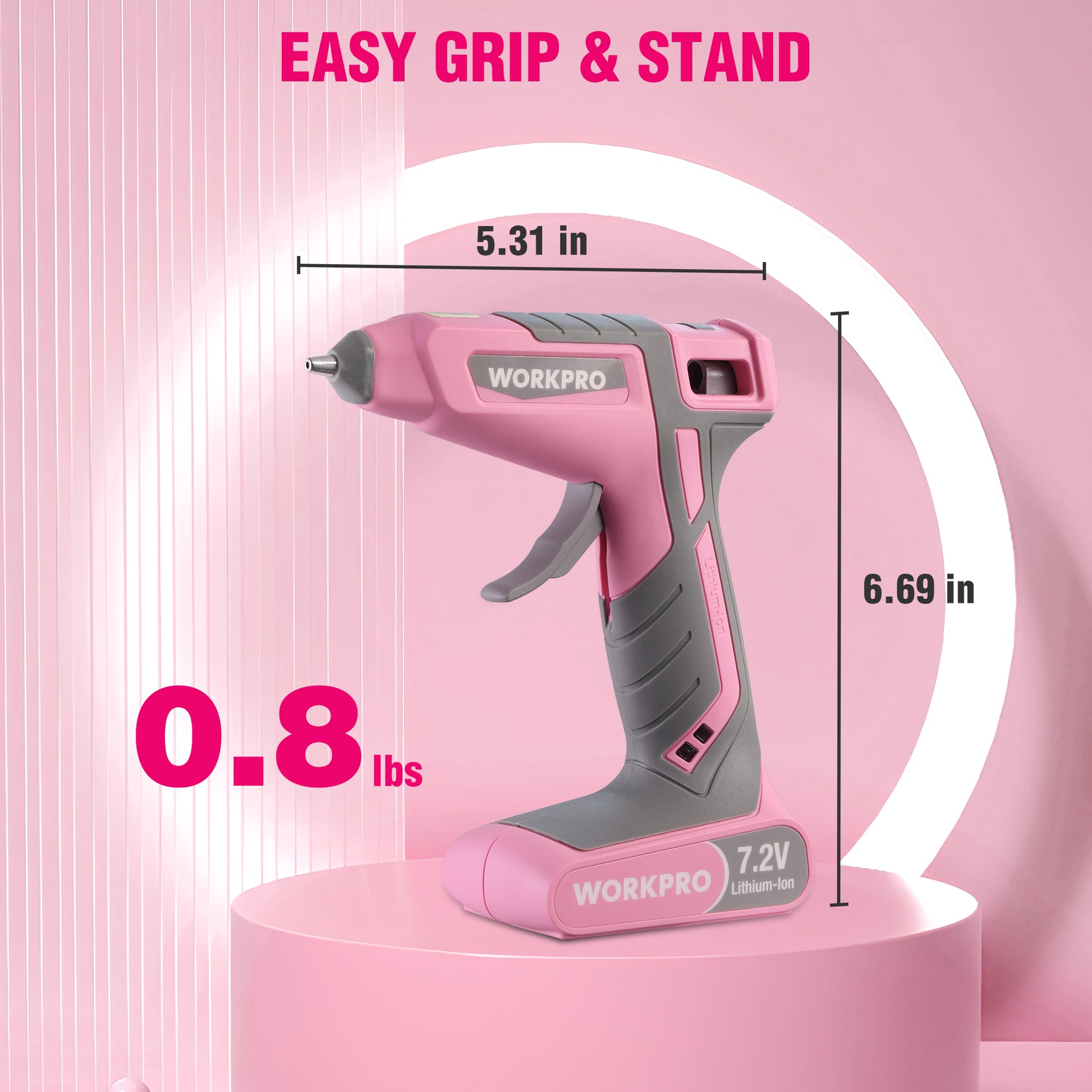Pink cordless hot glue gun standing upright on base, with gray nozzle and handle grip