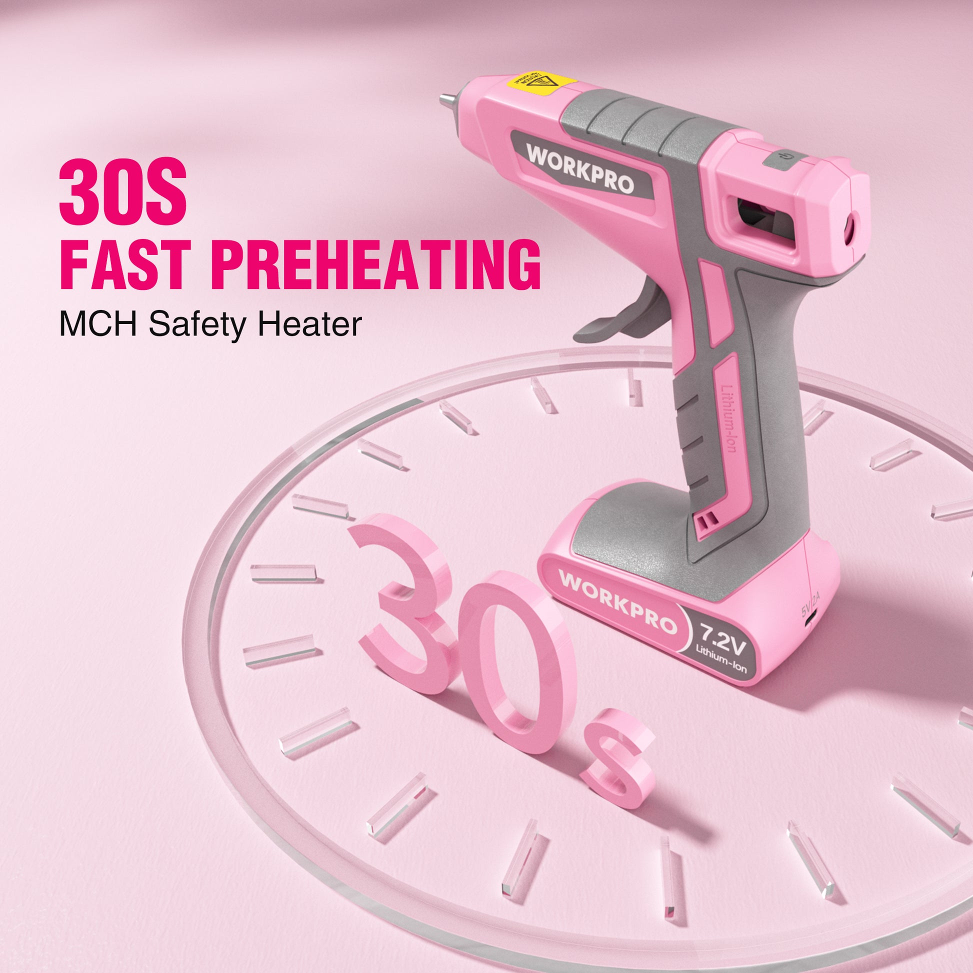 Pink cordless hot glue gun resting on round display platform, gray safety grip and nozzle
