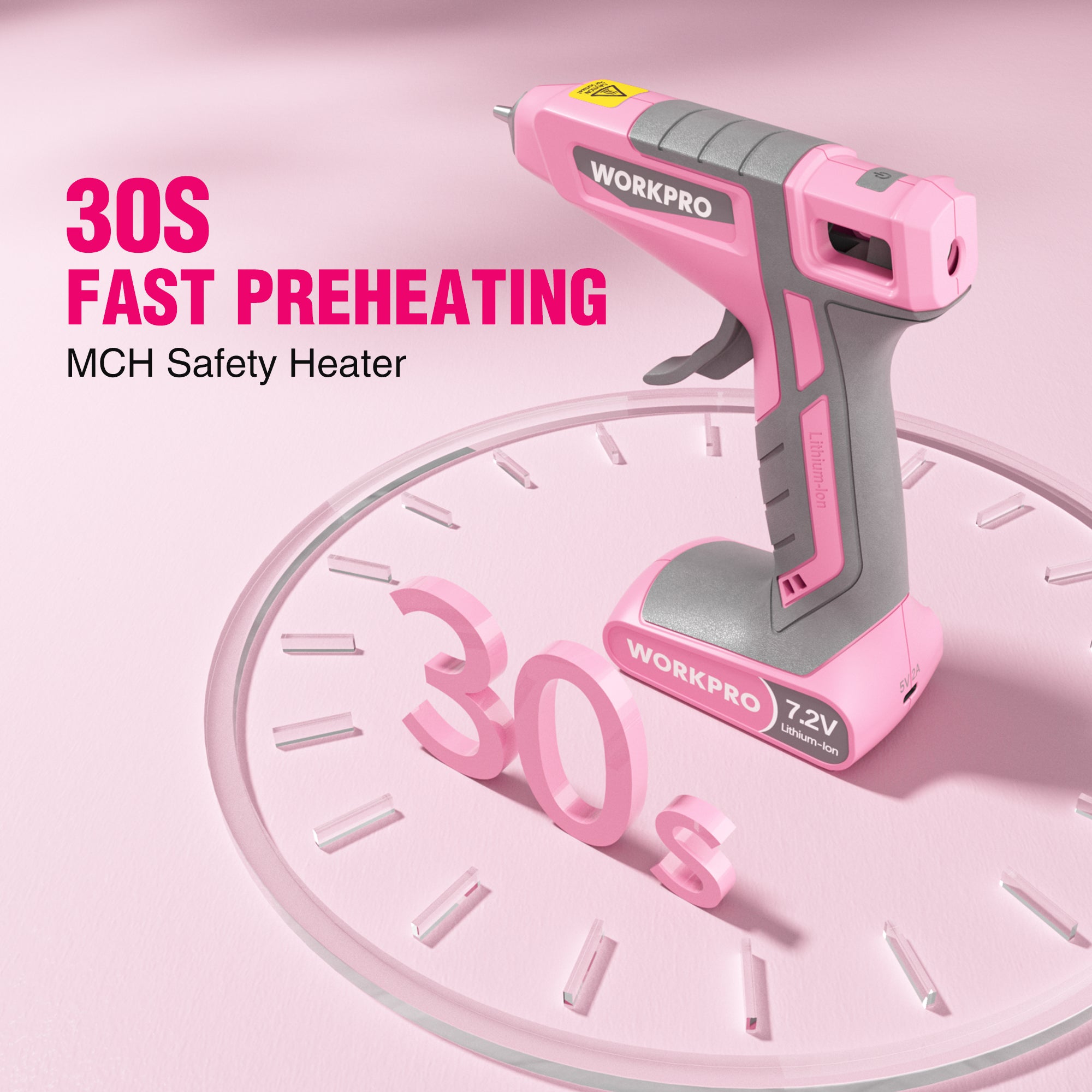 Pink cordless hot glue gun resting on round display platform, gray safety grip and nozzle