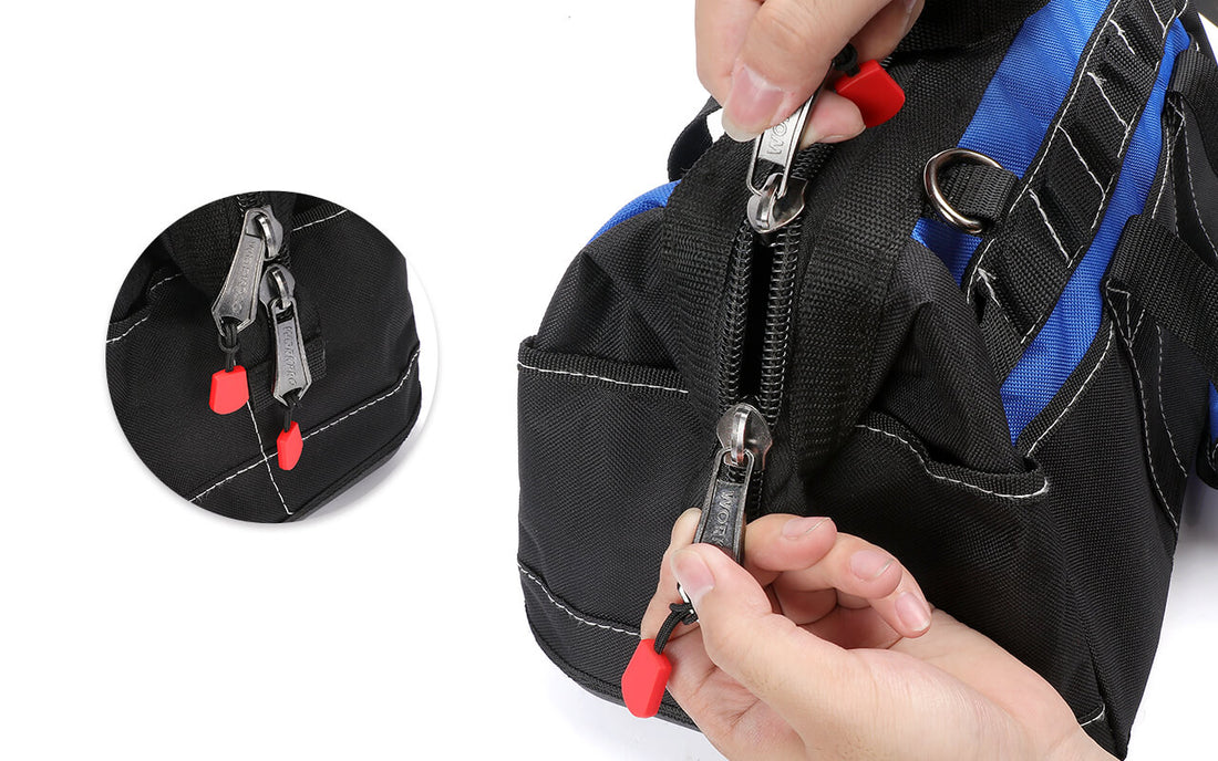 Durable tool belt with black fabric and blue trim, showing metal zippers and red pull tabs being fastened