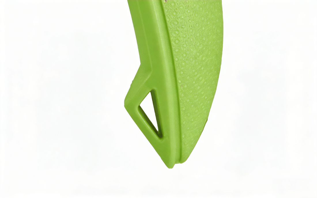 Green plastic scoop with a cutout handle opening, showing texture and an innovation shaped design