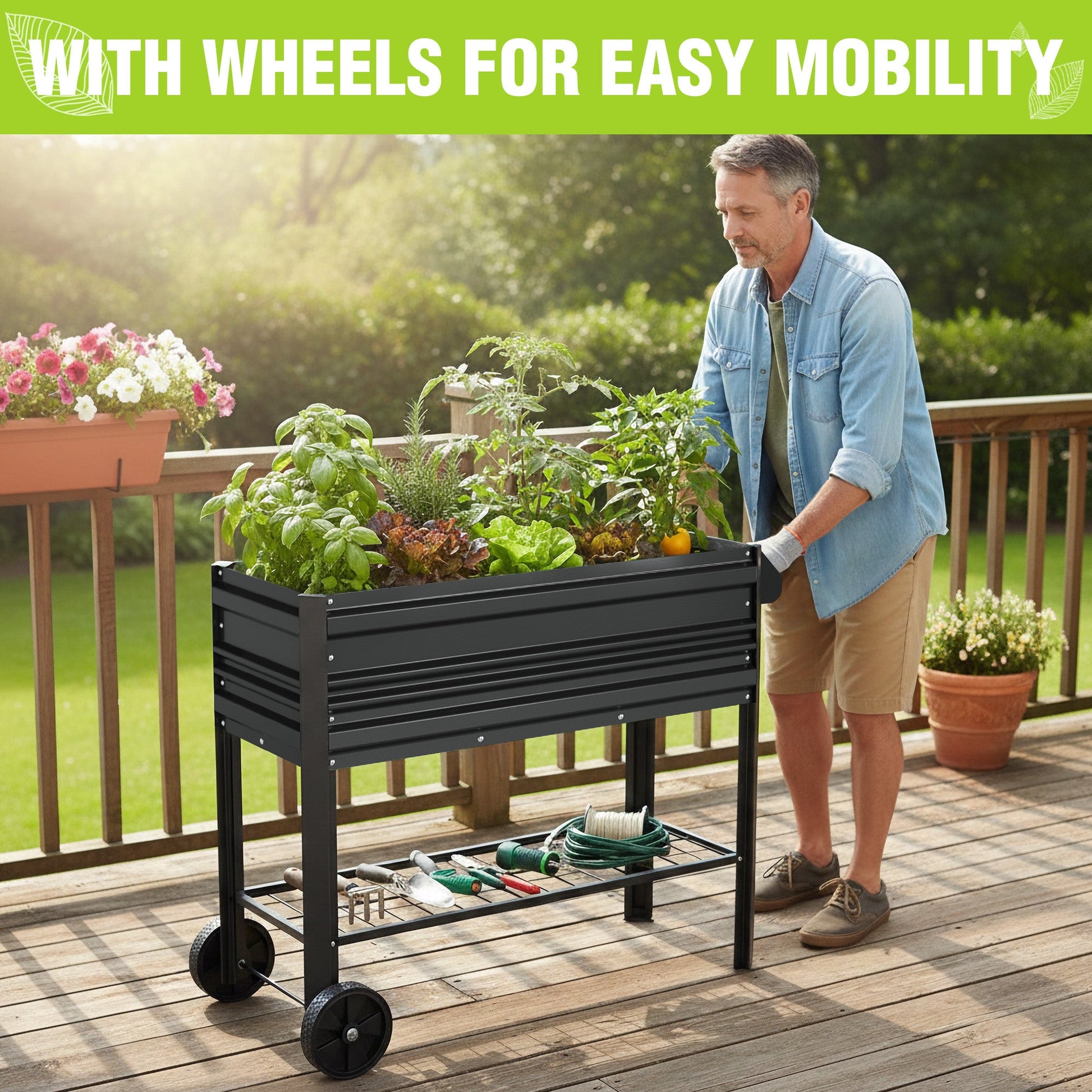 Black raised garden bed on wheels with bottom shelf and tools on the rack